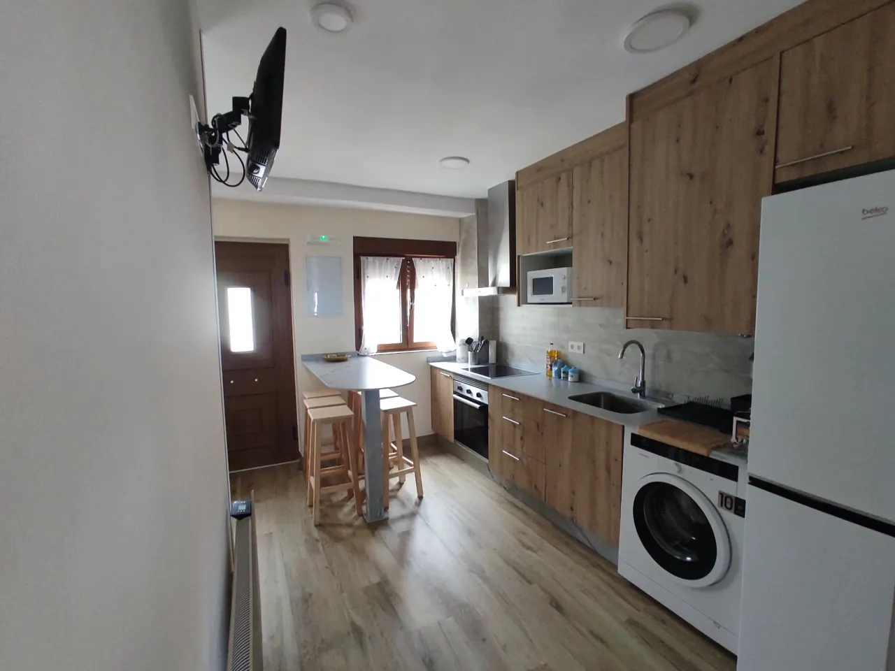 Fully equipped kitchen with washing machine and fridge